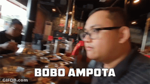 Man With Glasses At Table With Food Saying Bobo Ampota GIF