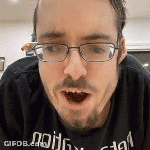 Man With Glasses Beard In Black Shirt Saying Nothing GIF