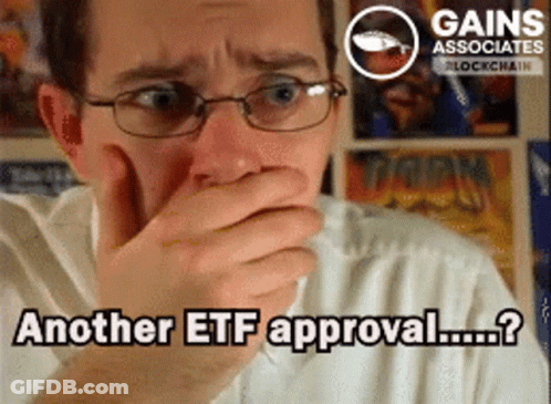 Man With Glasses Covering Mouth Another ETF Approval GIF