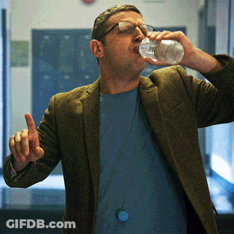 Man With Glasses Drinking From Bottle GIF