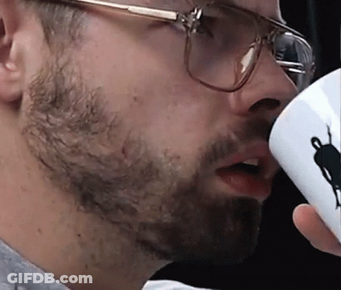 Man With Glasses Drinking From Cup With Silhouette GIF