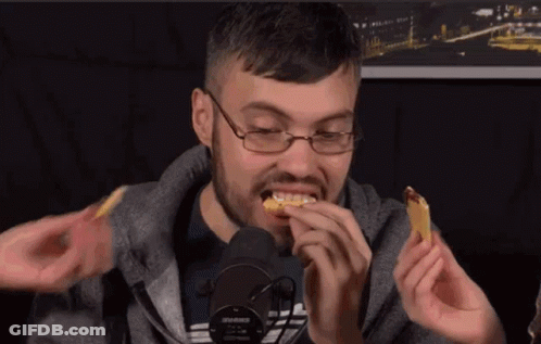Man With Glasses Eating At Microphone GIF
