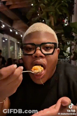 Man With Glasses Eating From Spoon GIF
