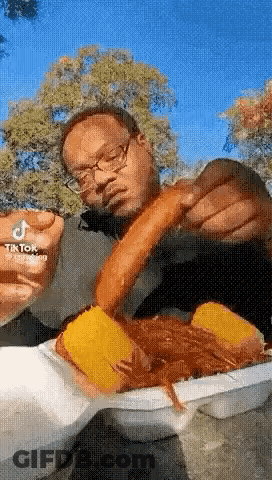 Man With Glasses Eating Hot Dog GIF