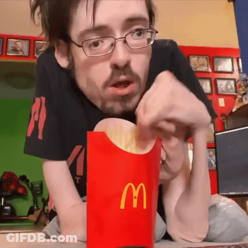 Man With Glasses Eating McDonald's Fries GIF
