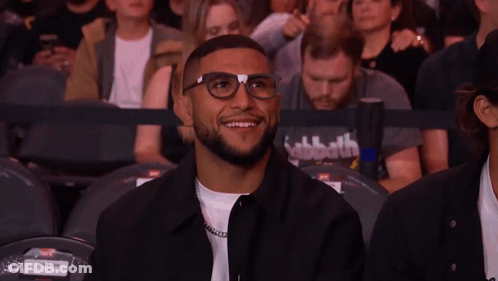 Man With Glasses Giving Peace Sign Watching UFC Fight GIF