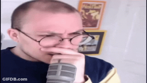 Man With Glasses Hand To Mouth GIF