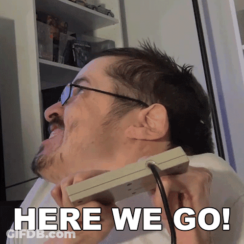 Man With Glasses Holding Controller Saying Here We Go GIF