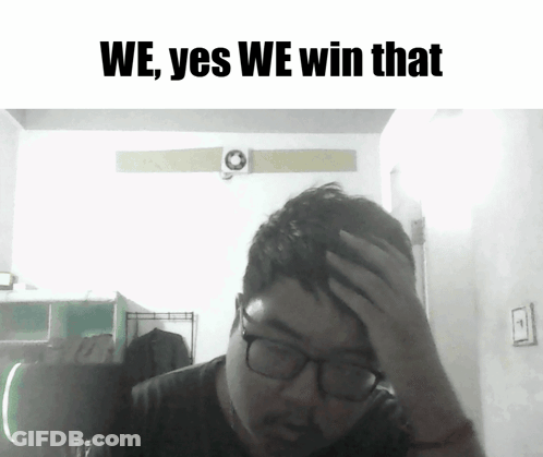 Man With Glasses Holding Forehand In Front Of We Yes We Win Sign GIF