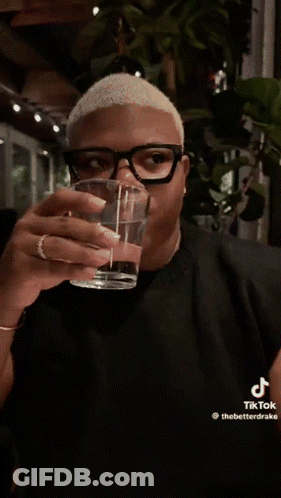 Man With Glasses Holding Glass Of Water GIF