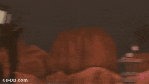 Man With Glasses Holding Gun Blue Light GIF
