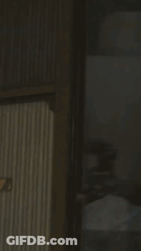 Man With Glasses Holding Gun Blue Light GIF