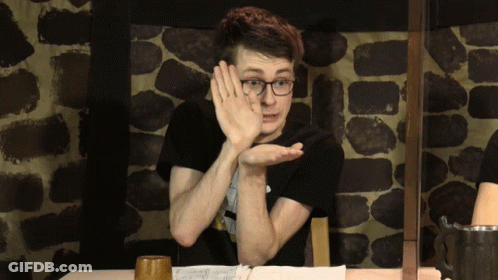 Man With Glasses Holding Hand To Face GIF