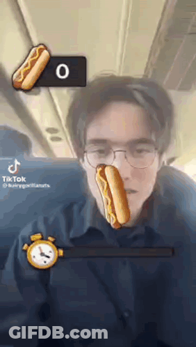 Man With Glasses Holding Hot Dog GIF