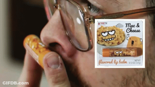 Man With Glasses Holding Mac And Cheese Lip Balm GIF
