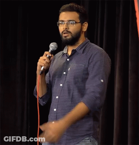 Man With Glasses Holding Microphone GIF