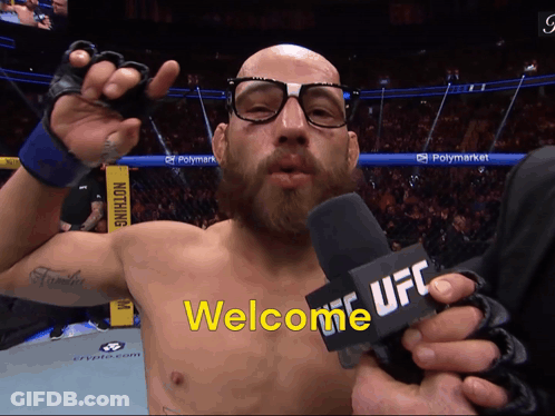 Man With Glasses Holding Microphone Saying Welcome UFC GIF