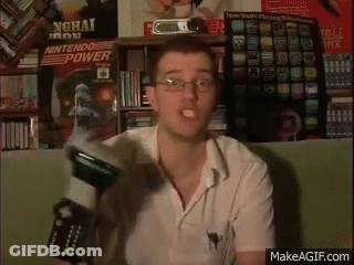 Man With Glasses Holding Nintendo Power Controller GIF