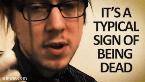 Man With Glasses Holding Sign It's A Typical Sign Of Being Dead GIF