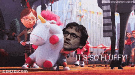 Man With Glasses Holding Stuffed Unicorn Saying It's So Fluffy GIF