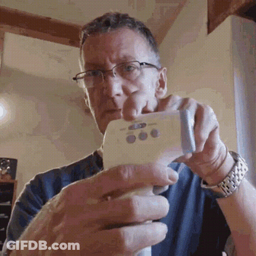 Man With Glasses Holding Thermometer GIF