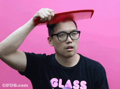 Man With Glasses In Black Shirt Saying Glass Combing Hair GIF