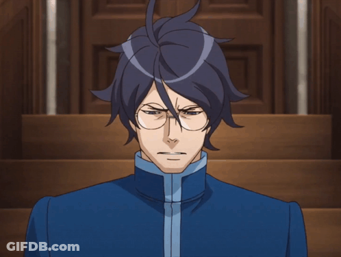 Man With Glasses In Blue Jacket Looking At Camera GIF