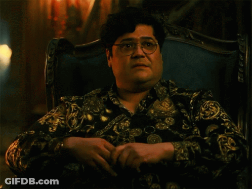 Man With Glasses In Chair Saying Shade GIF