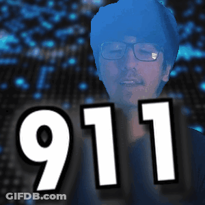 Man With Glasses In Front Of 911 Sign GIF