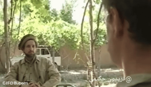 Man With Glasses In Front Of Afghanistan Flag GIF