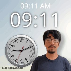 Man With Glasses In Front Of Clock 9:11 AM GIF