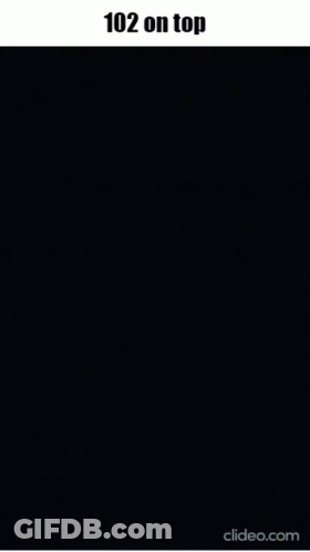 Man With Glasses In Front Of Clock At 1:02 AM GIF