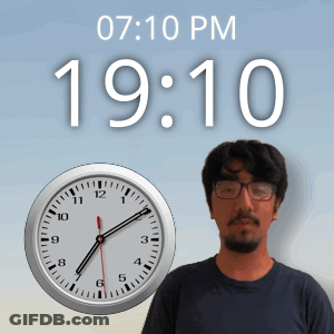 Man With Glasses In Front Of Clock At 19:10 GIF