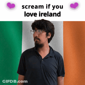 Man With Glasses In Front Of Irish Flag GIF