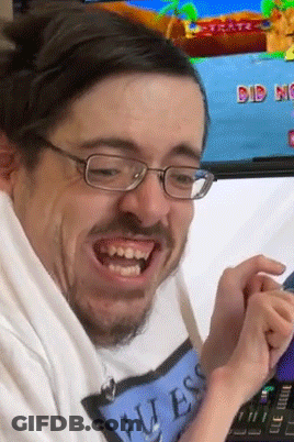 Man With Glasses In Guess Shirt Playing Game GIF