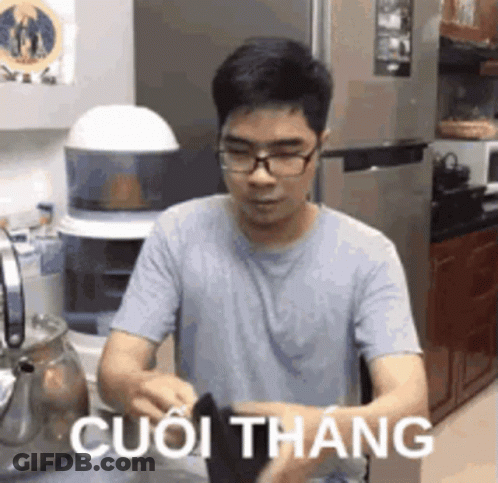Man With Glasses In Kitchen Foreign Language Shirt GIF