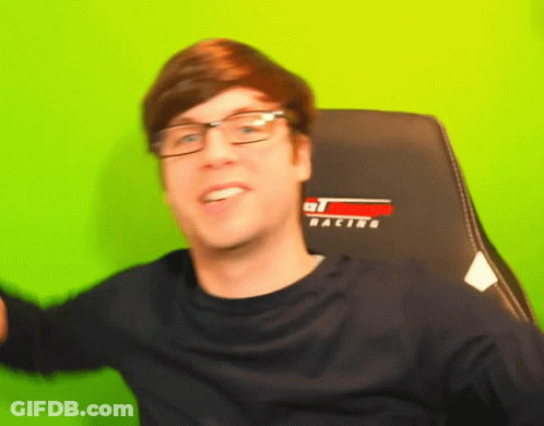 Man With Glasses In Racing Chair GIF