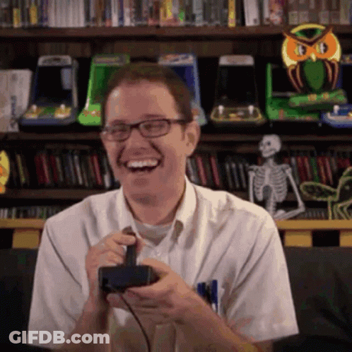 Man With Glasses Laughing With Controller GIF