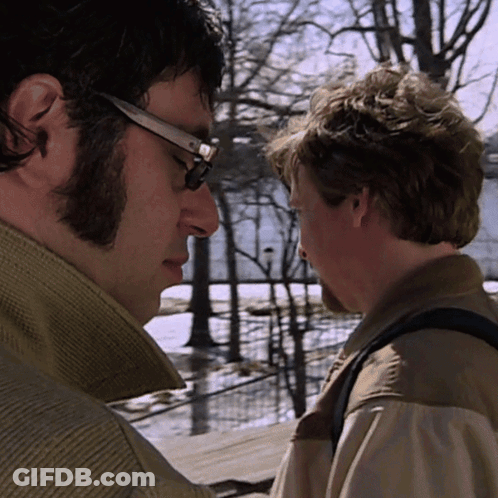 Man With Glasses Looking At Another Man GIF