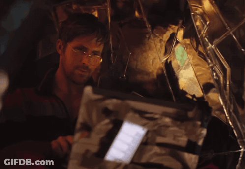 Man With Glasses Looking At Broken Mirror GIF