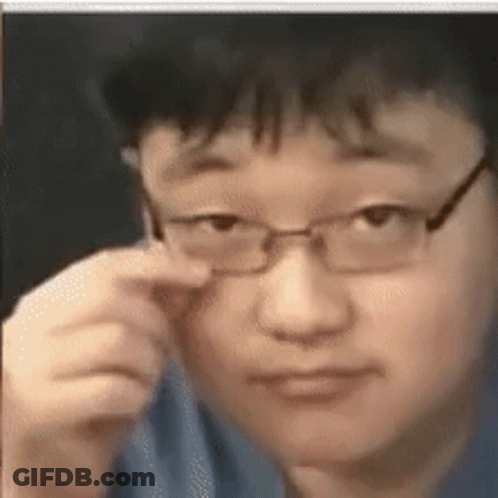 Man With Glasses Looking At Camera GIF