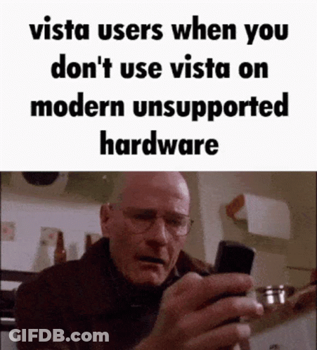 Man With Glasses Looking At Cell Phone Saying Vista Users When You Don't Use Vista On Modern Unsupported GIF
