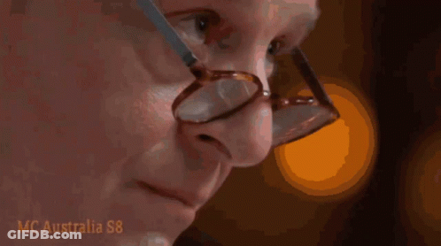 Man With Glasses Looking At Hand GIF