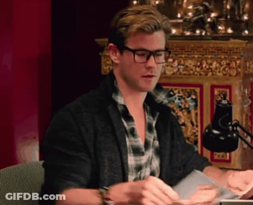 Man With Glasses Looking On Couch GIF