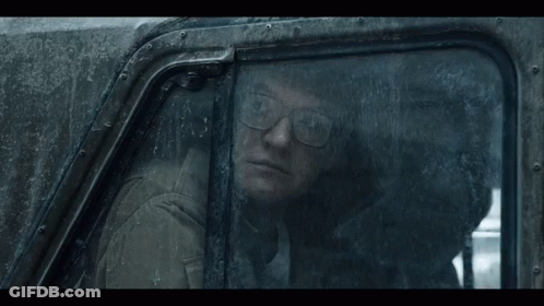 Man With Glasses Looking Out Car Window GIF