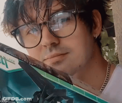 Man With Glasses Looking Out Car Window GIF