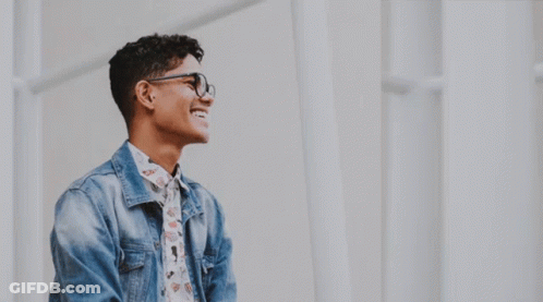 Man With Glasses Looking Through Telescope Smiling GIF