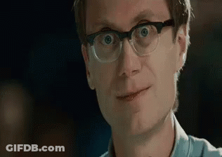 Man With Glasses Making Funny Face And Smiling GIF