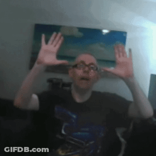 Man With Glasses Making Funny Face With Hands GIF