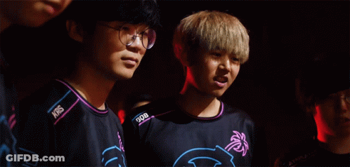 Man With Glasses Next To Man With NBS Shirt GIF